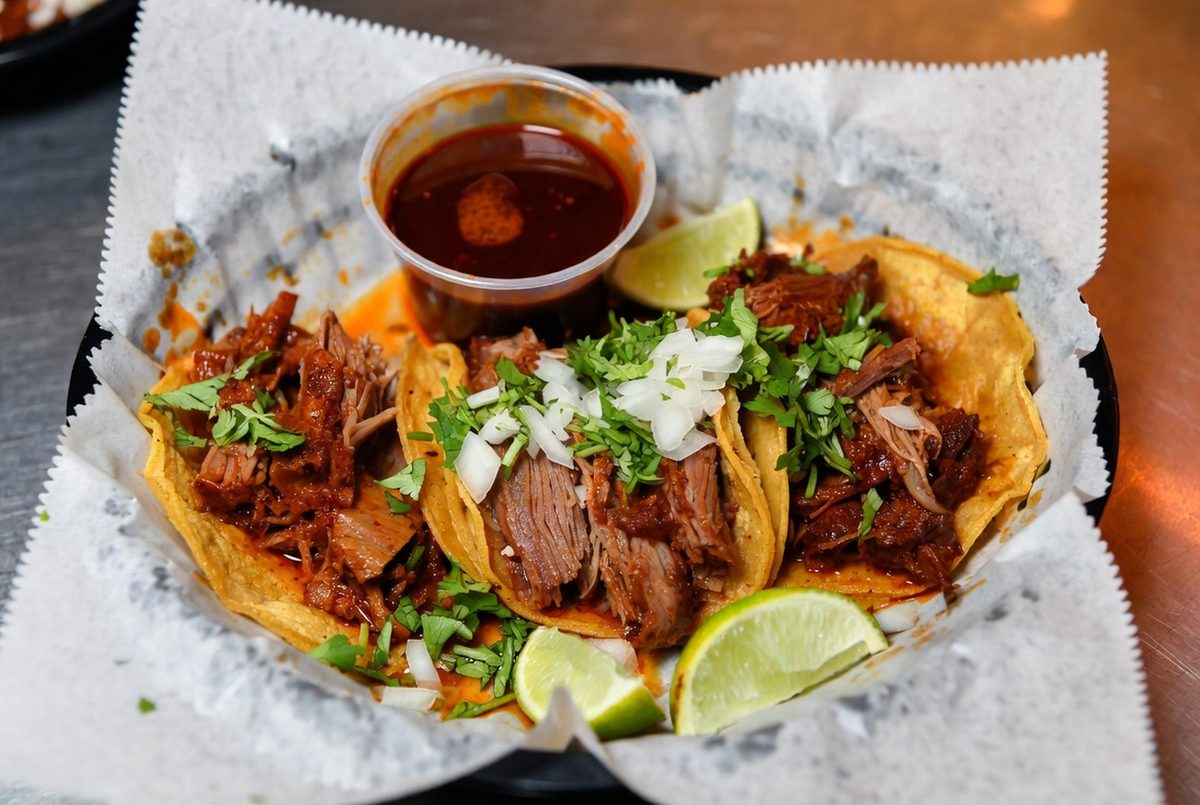 Birria tacos on a plate with consommé, a Valley weekend staple